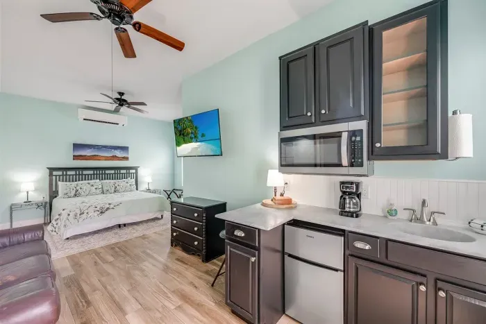 Primary suite with king bed, kitchenette and ensuite bathroom.