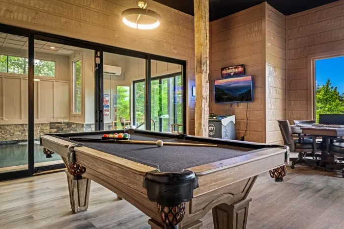 Game room with pool table, air hockey & Big Buck Hunter Arcade Game