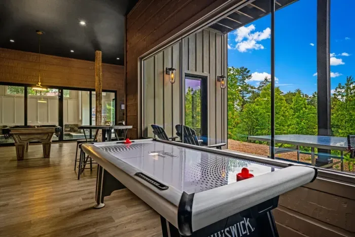 Game room with air hockey, pool table & Big Buck Hunter Arcade Game