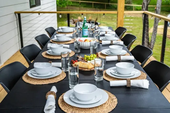 Enjoy meals on the upper deck’s dining table, seating up to 10 guests.