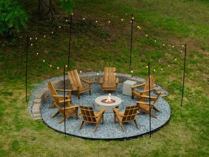 Tucked into the backyard under string lights, this spacious fire pit area seats eight in Adirondack chairs—perfect for evening hangs and easy conversation around the fire.