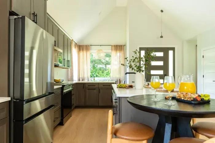 A fully stocked kitchen with sleek stainless appliances—ready for anything from big family meals to late-night snacks.