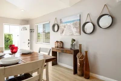 A perfect blend of dining and decor. Step inside, set your bags down, and feel instantly at home in this charming coastal space.
