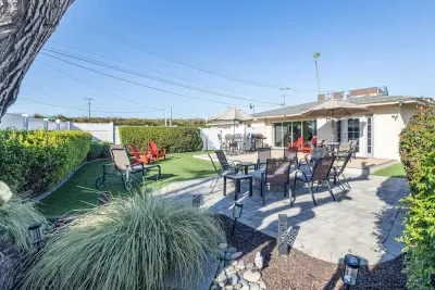 Step outside into this incredible multi-functional backyard designed for making memories. Whether you're grilling up a feast on the BBQ, sipping wine on the red Adirondack chairs.