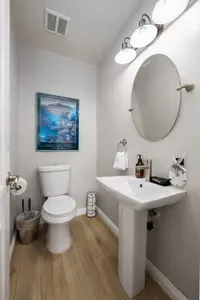A stylish and convenient half bath with unique decor—everything you need for a comfortable stay.