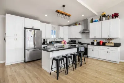 This kitchen is as beautiful as it is functional. Featuring contemporary design, all the necessary cooking essentials, and ample counter space, you're ready for any meal. Gather around the stylish breakfast bar with seating to enjoy a quick bite.