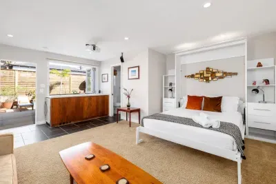 Step into a serene, high-design sanctuary where mid-century art meets modern smart-home luxury. This versatile suite offers an immediate sense of airy sophistication.