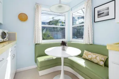Thoughtfully decorated with minimalist framed photography and clean, mint-blue walls for a serene, boutique stay experience.