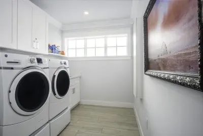 New washer and dryer with ironing board and iron