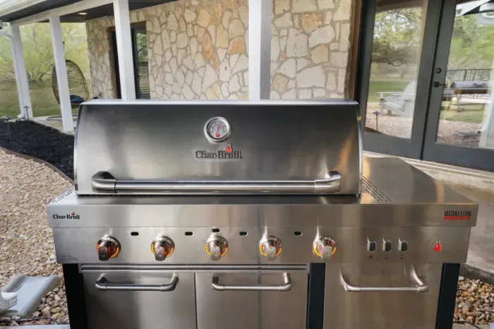 Five burner outdoor grill to grill steaks, burgers and hot dogs.
