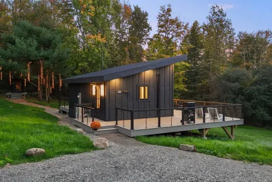 As twilight settles over Fernova, The Kimberly glows with warm light against the trees. Unwind on the deck surrounded by beautiful string lights that light up the sauna area.