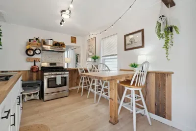 Front cottage fully renovated (spring 2022) eat-in kitchen with butcher block countertops.