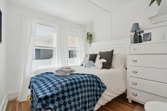 Front Cottage second bedroom comes with refinished floors, large bureau and comfy memory foam full sized bed.