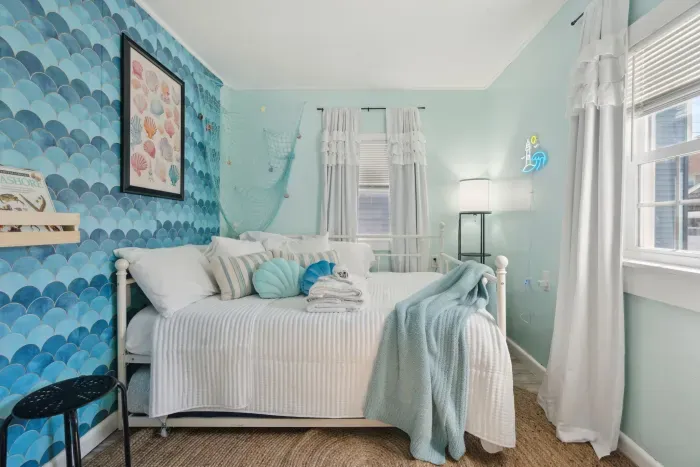 Back Cottage 2nd Bedroom trundle bed easily rolls under full-sized bed for smaller groups and greater comfort.