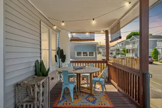 The front cottage boasts a large porch to relax, eat dinner, and take in the ocean breeze.