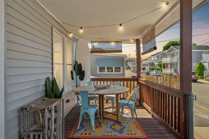 The front cottage boasts a large porch to relax, eat dinner, and take in the ocean breeze.