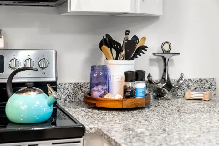 Open living room & kitchen, with mounted smart TV, Dining table, strong WiFi, sleeper sofa and fully-equipped kitchen