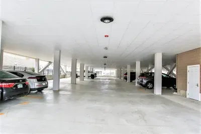 1 complimentary covered garage parking spot