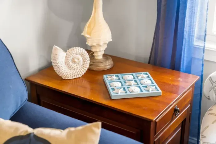 Open living room & kitchen, with mounted smart TV, Dining table, strong WiFi, sleeper sofa and fully-equipped kitchen