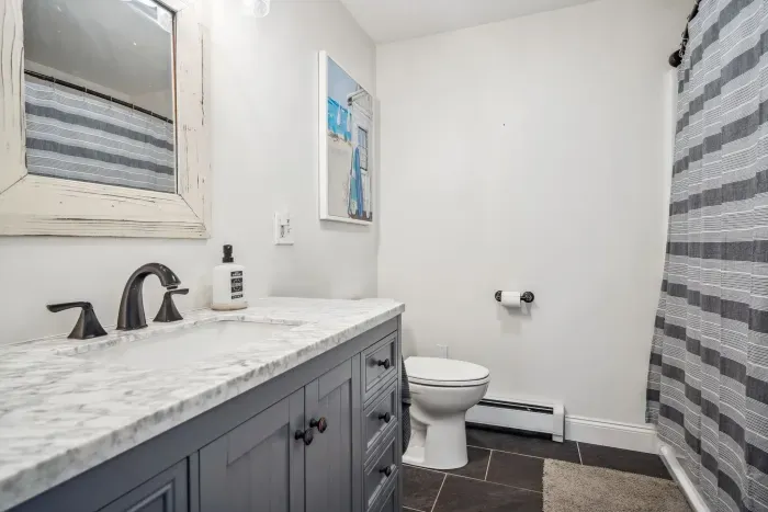 The second full bathroom on the second floor with a shower tub combo. Clean towels provided