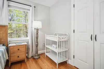 The fourth bedroom with a full bed, crib, and changing table. Clean linens provided!