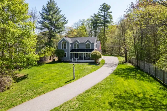 Aerial view of the home and the large front yard