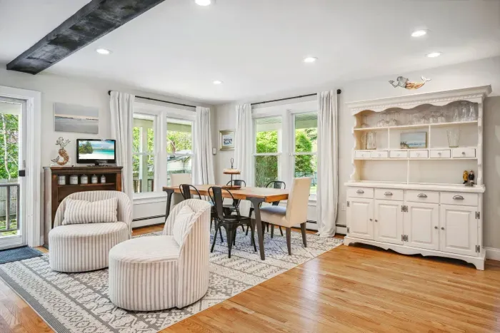 The dining area with seating for 6 at the table with 4 additional seats at the island. Two fun swivel chairs!