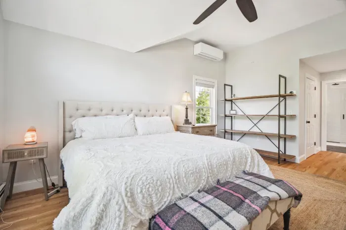 The primary bedroom with a king bed, smart tv, ceiling fan, and ensuite bathroom. Clean towels and linens provided!