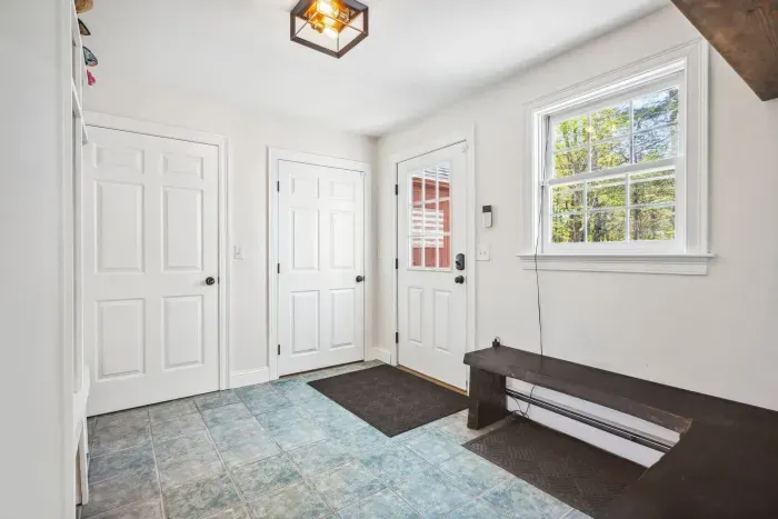 Mudroom located on the main level off of the side entrance. Plenty of storage for jackets and shoes