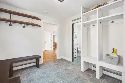 Mudroom located on the main level off of the side entrance. Plenty of storage for jackets and shoes