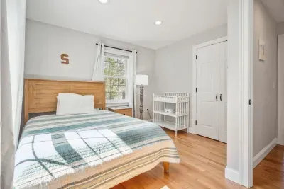 The fourth bedroom with a full bed, crib, and changing table. Clean linens provided!