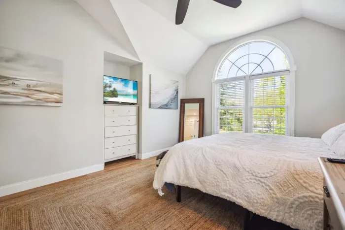 The primary bedroom with a king bed, smart tv, ceiling fan, and ensuite bathroom. Clean towels and linens provided!