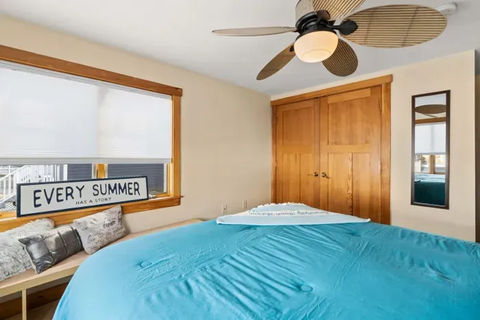 Bedroom #1 with a Queen bed, ceiling fan, and clean, provided linens. Clean towels provided for all guests!