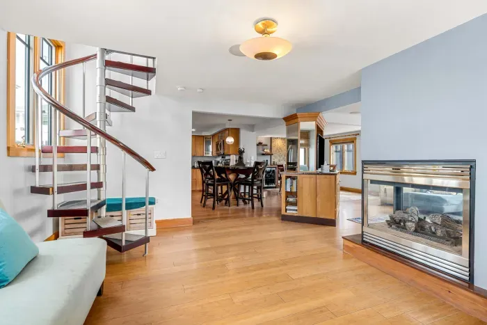 Secondary entryway with a sitting area, and gas fireplace!

