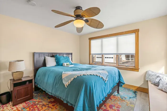 Bedroom #1 with a Queen bed, ceiling fan, and clean, provided linens. Clean towels provided for all guests!