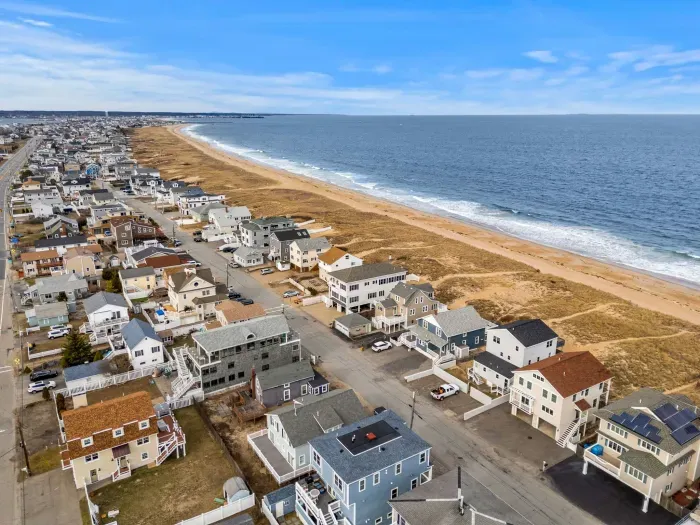 Aerial view of the home! Just steps to the beach via a private beach access.