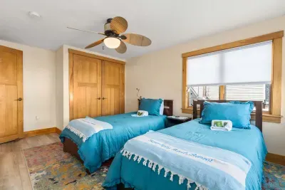 Bedroom #4 with 2 twins! Clean linens and towels provided for all guests. There is access to the Commonwealth Ave side of the property here