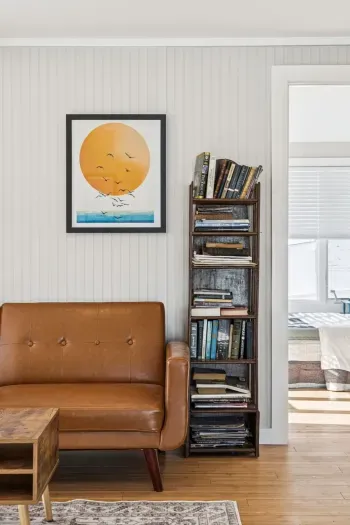 The living room with plenty of seating and a Smart TV. Plenty of natural light also!