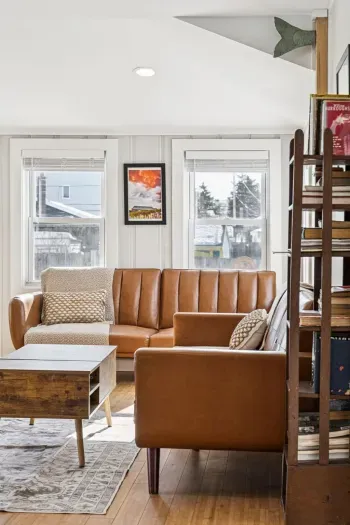 The living room with plenty of seating and a Smart TV. Plenty of natural light also!