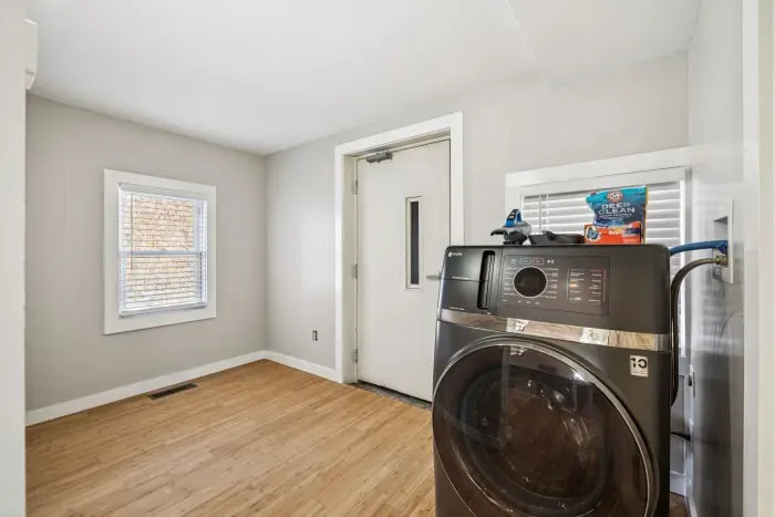 In unit laundry located conveniently outside of the bathroom.