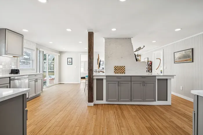 There's barstool seating for 4 and a high top table with seating for 3 located in the kitchen.