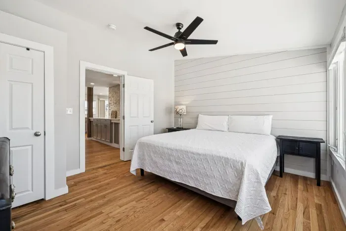 The primary bedroom with a king bed, smart TV, minisplit heating/cooling, and plenty of natural light! Clean linens provided.