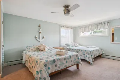 Back unit bedroom #1 with two full beds and ensuite full bathroom