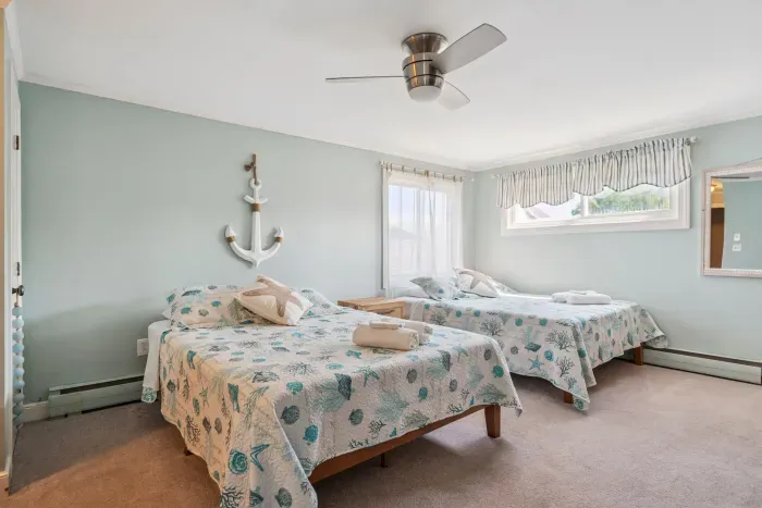 Back unit bedroom #1 with two full beds and ensuite full bathroom