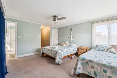 Back unit bedroom #1 with two full beds and ensuite full bathroom