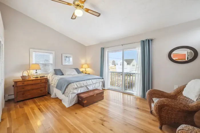 The primary bedroom - this room has a queen bed, smart TV, and a slider with ocean views. Clean linens provided