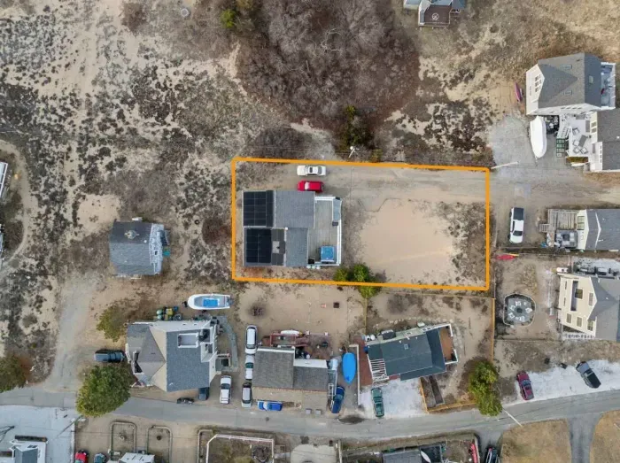 This boundary marks the property. Parking extends all the way to the far orange line. Plenty of parking for vehicles. Please do not block our neighbors driveways. The volleyball area is a great place for games!