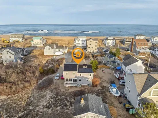 An aerial of the home. It is located just steps to the beach!
