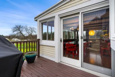 Propane grill and deck access though sliding doors to dining room.
