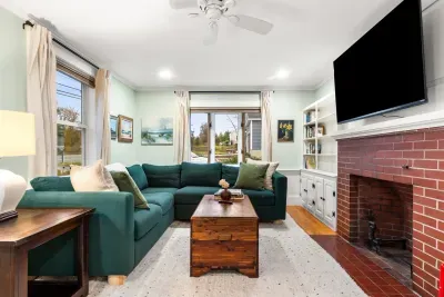 Living room with sectional couch for ample seating and smart TV with the ability to login to your streaming services